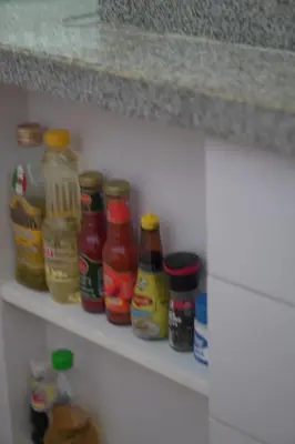 a row of condiments on a shelf in a refrigerator at 4bedroom Villa Siray Beach Front in Phuket Town