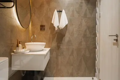 a bathroom with a white sink and a toilet at Title Halo Tenderness Naiyang Pool View Gym in Nai Yang Beach