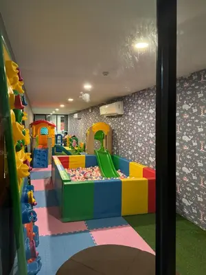 a childrens play room with a play area with a play room at Mida Grande Resort Surin by Mill in Surin Beach