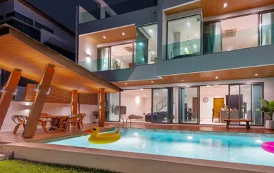 an image of a house with a swimming pool at Eva Beach Villa\u62c9\u5a01\u4e09\u5367\u5168\u6d77\u666f\u522b\u5885 in Ban Saiyuan (1)