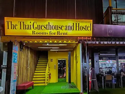 a sign for the that guest house and house rooms for rent at The Thai Guesthouse and Hostel in Patong Beach