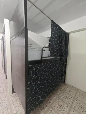 a room with a closet with black and white tiles at Phuket Inn Patong Hub in Patong Beach