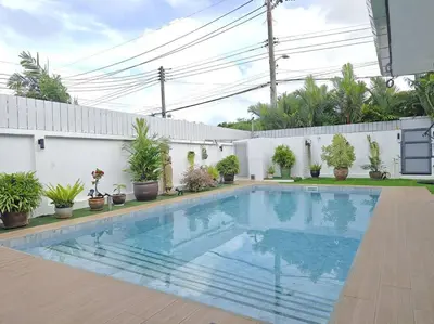 a swimming pool in a yard with potted plants at Villa 3 Chambres avec piscine, Rawai, Phuket in Ban Saiyuan (1)