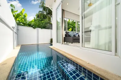 a swimming pool in the backyard of a house at 2 Bedrooms Villa in Rawai - v6 t in Ban Saiyuan (1)