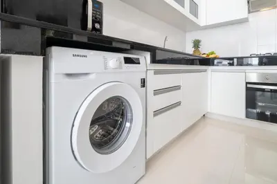 a white laundry room with a washer and dryer at 2 Bedrooms Villa in Rawai - v6 t in Ban Saiyuan (1)