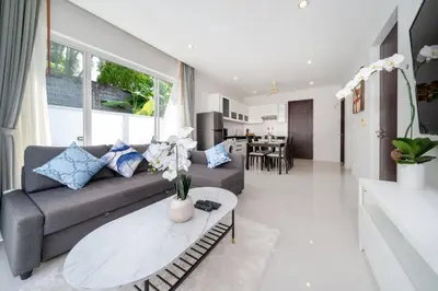 a living room with a couch and a table at 2 Bedrooms Villa in Rawai - v6 t in Ban Saiyuan (1)