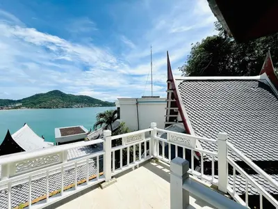 a balcony of a house with a view of the water at Moonlight Panorama Seaview House by RESAVA in Surin Beach
