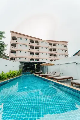 a swimming pool in front of a hotel at Saiyuan Residence Phuket in Rawai Beach