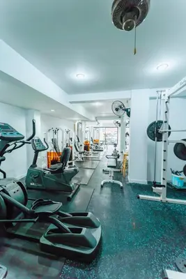 a gym with treadmills and elliptical machines at Saiyuan Residence Phuket in Rawai Beach