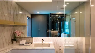 a bathroom with a sink and a glass shower at Apartment 2 bedrooms on Surin in Surin Beach