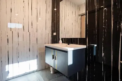a bathroom with a sink and a mirror at Golden Sands Villa only 15 minutes walk to beach in Surin Beach