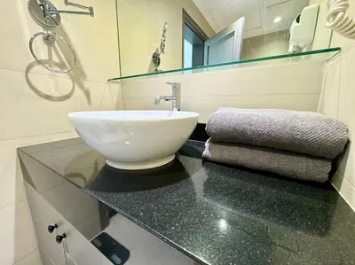 a bathroom with a sink on a counter with a mirror at Allamanda Laguna Phuket 2 bedroom apartment Bang Tao Beach in Laguna Phuket