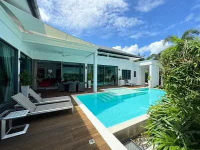 a swimming pool in the backyard of a house at Aromdee 2 Villa by G Estate Phuket in Ban Saiyuan (1)