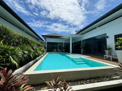 a swimming pool in the backyard of a house at Aromdee 2 Villa by G Estate Phuket in Ban Saiyuan (1)