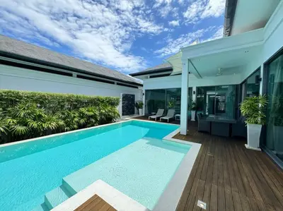 a swimming pool in the backyard of a house at Aromdee 2 Villa by G Estate Phuket in Ban Saiyuan (1)