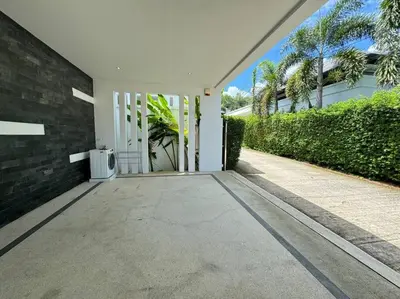 an open door of a house with a driveway at Aromdee 2 Villa by G Estate Phuket in Ban Saiyuan (1)