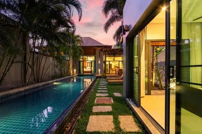 an exterior view of a house with a swimming pool at Villa Laut 3BR Private Pool 10 min to Nai Harn in Rawai Beach