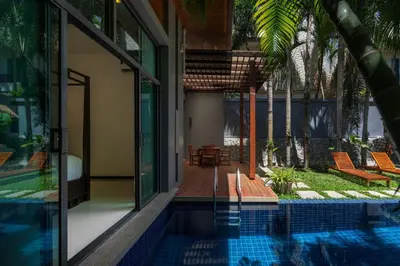 an external view of a house with a swimming pool at Villa Laut 3BR Private Pool 10 min to Nai Harn in Rawai Beach