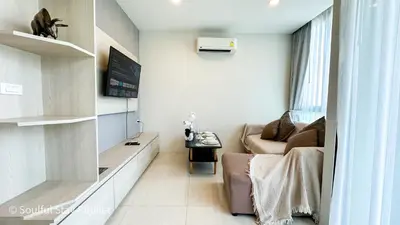 a small living room with a couch and a table at Soulful Stay Phuket -Distant Seaview and Mountain View Retreat, Patong in Patong Beach