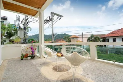a balcony with a table and chairs on it at Apartment 1 Bedroom in Naiharn t in Ban Saiyuan (1)