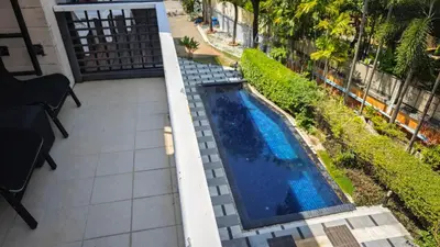 an overhead view of a swimming pool on a balcony at Apartments Kata Beach view garden in Kata Beach
