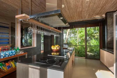 a kitchen with a stove and a counter top at Villa Viva Panwa in Ban Laem Phan Wa
