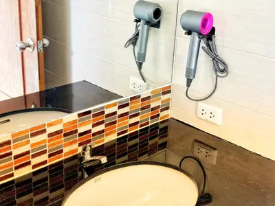 a bathroom with a shower and a toilet in it at patong v hotel in Patong Beach