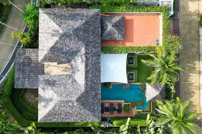 an aerial view of a house with a roof at Charming Chom Tawan Villa 3 bdr in Layan Beach