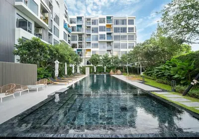 an image of a swimming pool in front of a building at New 1 br studio in Laguna Phuket in Phuket Town
