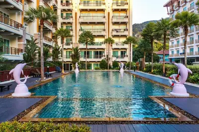 a swimming pool in the middle of a building at Private apartment at Phuket Villa Condo in Patong Beach