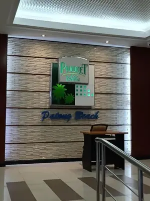 a wall in a lobby with a parenthood at Private apartment at Phuket Villa Condo in Patong Beach