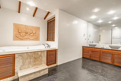a bathroom with two sinks and a tub at Villa Suriya B2 in Patong Beach