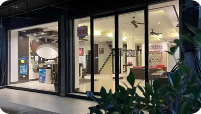 a store front with glass windows and a view of a store at The Star House in Patong Beach