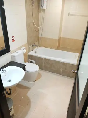 a bathroom with a tub and a toilet and a sink at The Star House in Patong Beach