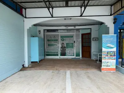 an entrance to a building with a woman inside at Best Rent a Room in Nai Yang Beach