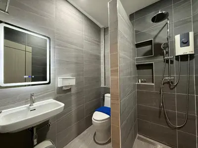 a bathroom with a shower and a toilet and a sink at Best Rent a Room in Nai Yang Beach