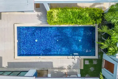 an overhead view of a swimming pool in a building at 2 Beds large pool night market Soi Namjai v122 in Rawai Beach
