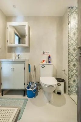 a bathroom with a toilet and a sink and a shower at Cozy Studio Apartment at Naiyang Beach G507 in Phuket Town