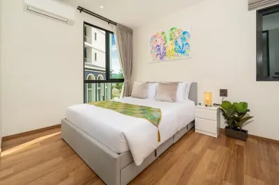 a bedroom with a white bed and a window at The Halo 1 Naiyang Beach in Nai Yang Beach