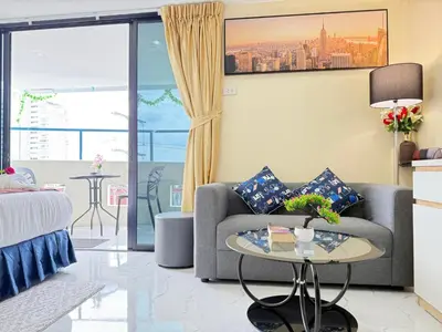 a living room with a couch and a table at Heaven House Restro & Bar in Patong Beach