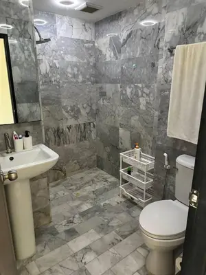 a bathroom with a toilet and a sink at Nai Harn Beach Condo (P1) in Rawai Beach