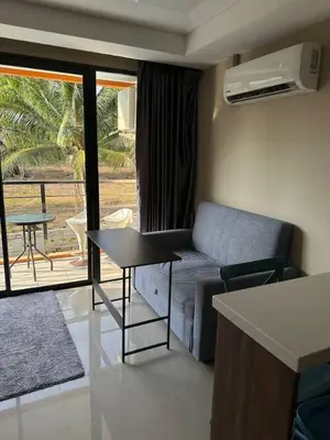 a small living room with a couch and a table at Nai Harn Beach Condo (P1) in Rawai Beach