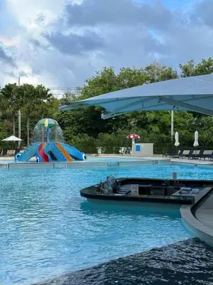 a large swimming pool with a water park at Spacious apartment 600m from the beach in Rawai Beach