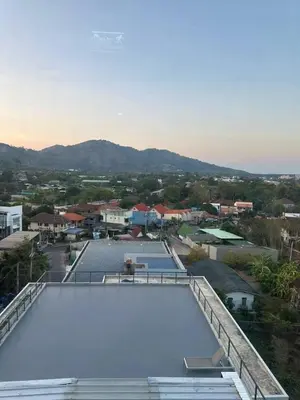 a large swimming pool on top of a roof at ReLife The Windy NaiHarn (716) in Ban Saiyuan (1)