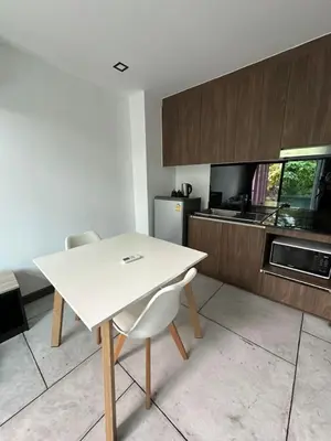 a white table and chairs in a kitchen at Utopia Naiharn Beach B17 in Rawai Beach