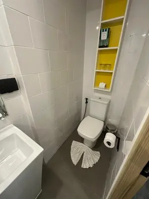 a bathroom with a white toilet and a sink at Duplex studio on Naiharn Beach B21 in Rawai Beach