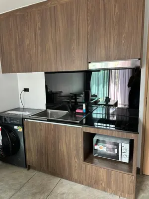 a kitchen with a sink and a microwave at Duplex studio on Naiharn Beach B21 in Rawai Beach