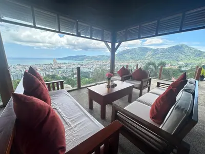 a room with couches and a view of a city at Villa Moon Talay View in Patong Beach