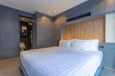 a bedroom with a large white bed in a room at C141 Fully Loaded Best Facilities Nicest Apartment in Kamala Beach