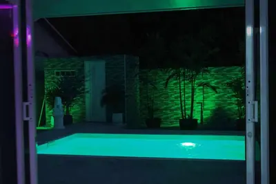 a swimming pool at night with green lights at Prestige Pool Villa by Karon Homes in Karon Beach